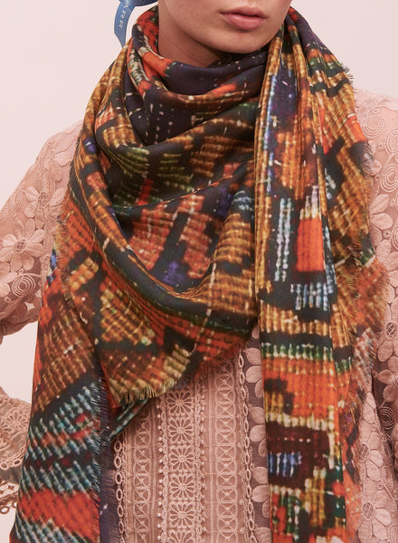 THE CARPET SQUARE - Navy and orange printed modal cashmere scarf - model