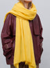 JANE CARR - THE LUXE - Yellow oversized pure cashmere knit wrap - model