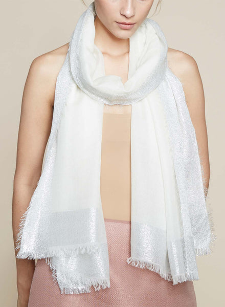 JANE CARR The Argent Wrap in White, white pure cashmere scarf with silver metallic border – model