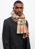 JANE CARR The Plaid Scarf in Tan, orange multicolour grid wool and cashmere scarf – model 4