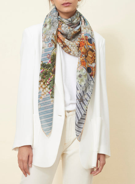 JANE CARR The Mirage Square in Blossom, pink and blue multicolour printed modal and cashmere scarf – model 1