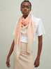 The Jenga Square, orange and camel checked lambswool scarf – model