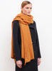 JANE CARR The Luxe in Tan, orange oversized cashmere knit wrap - model 3