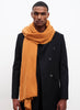 JANE CARR The Luxe in Tan, orange oversized cashmere knit wrap - model 2