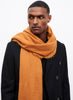 JANE CARR The Luxe in Tan, orange oversized cashmere knit wrap - model 4