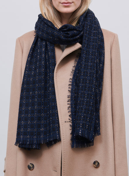 JANE CARR, THE TILE SCARF - Navy and black checked cashmere scarf with silver Lurex - model