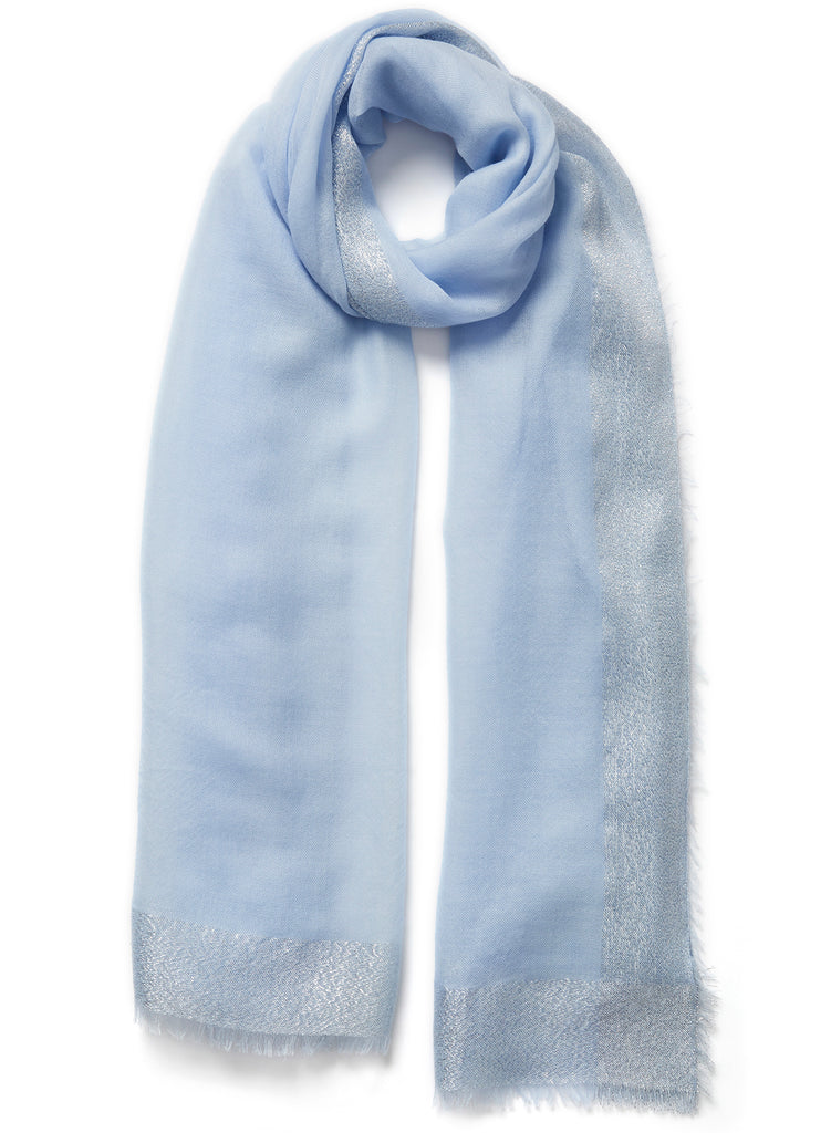 JANE CARR - THE ARGENT WRAP - Pale blue pure cashmere scarf with silver metallic border - tied