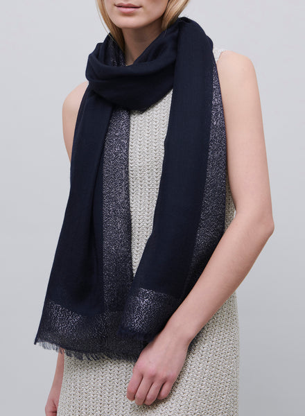 JANE CARR - THE ARGENT WRAP - Navy pure cashmere scarf with dark silver metallic border - model