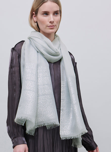 JANE CARR - THE TANGO SCARF - Pale grey pure cashmere scarf with silver metallic stripes - model
