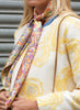 JANE CARR The Granny Smith Foulard in Sunset, yellow multicolour printed silk twill scarf – model
