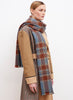 JANE CARR The Plaid Scarf in Opal, orange and blue grid wool and cashmere scarf – model 3