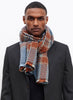 JANE CARR The Plaid Scarf in Opal, orange and blue grid wool and cashmere scarf – model 2