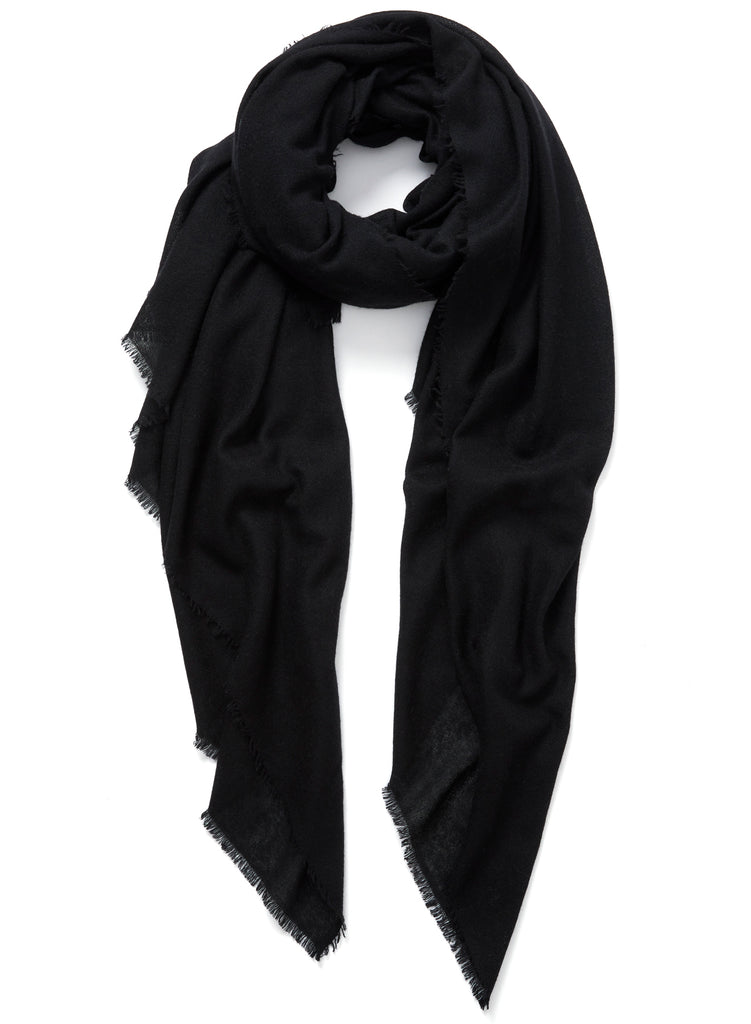 JANE CARR The Fray Wrap in Black, black woven pure cashmere scarf – tied