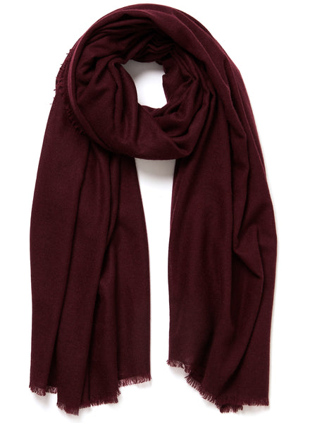 JANE CARR The Fray Wrap in Raisin, burgundy woven pure cashmere scarf – tied