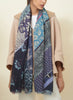JANE CARR The Puzzle Wrap in Lagoon, blue multicolour printed modal and cashmere scarf – model 1