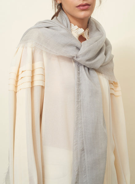 JANE CARR The Sheer Fray Square in Mist, light grey super fine pure cashmere scarf - model