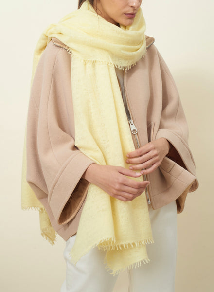 JANE CARR The Luxe in Ice Cream, pale yellow oversized pure cashmere knit wrap - model