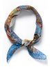 JANE CARR The Prairie Neckerchief in Kingfisher, blue multicolour printed cotton and silk-blend scarf – tied