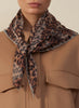 JANE CARR The Cub Neckerchief in Smoke, taupe grey printed modal and cashmere scarf – model 1
