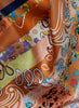 The Anagram Necker, orange and blush multicolour printed silk twill scarf - detail
