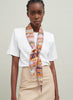 The Anagram Necker, orange and blush multicolour printed silk twill scarf - model 2