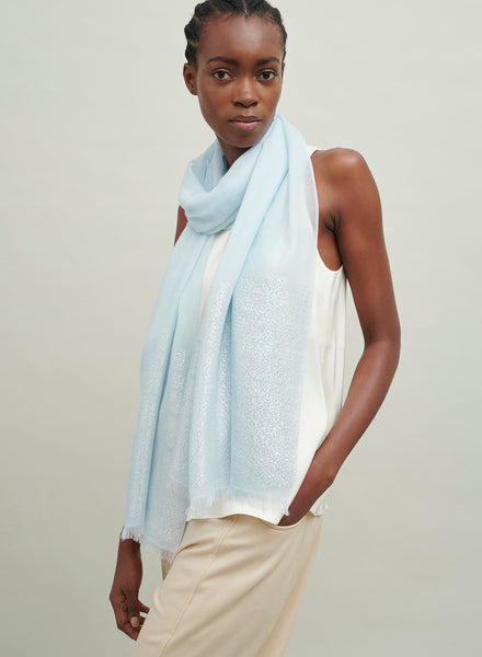 The Tango Scarf, pale blue pure cashmere scarf with metallic stripes – model