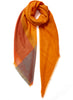 The Shimmer Square, orange pure cashmere scarf with blue metallic border – tied